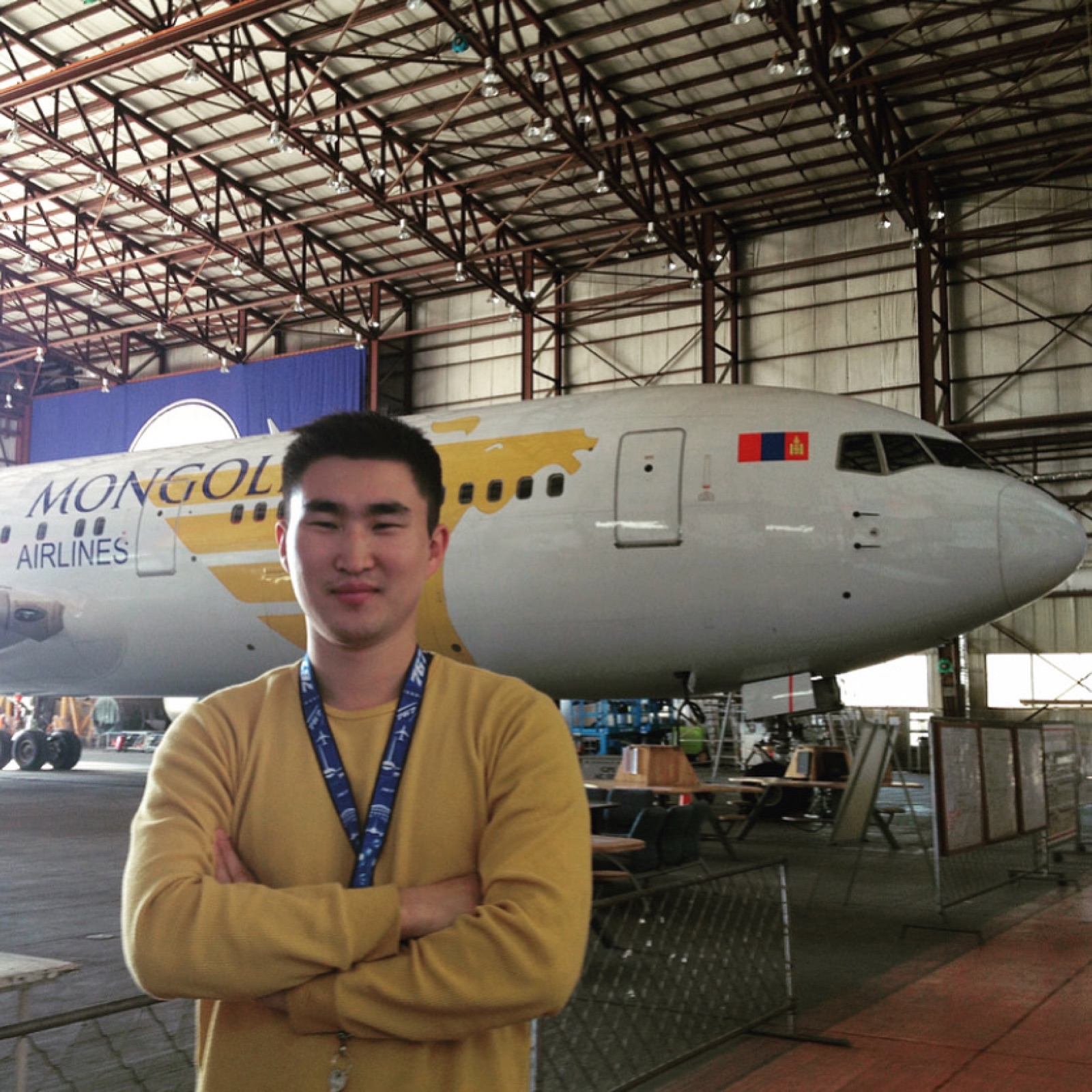 Ider-Od in a MIAT hangar with an aircraft